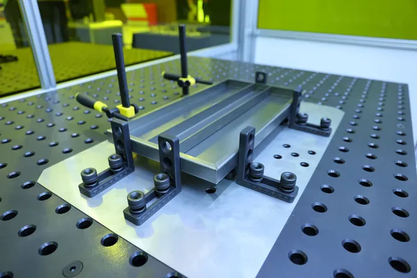 Sheet metal assembly clamped in modular welding fixturing